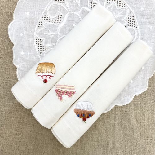 Hand-embroidered table napkins with ice cream pattern